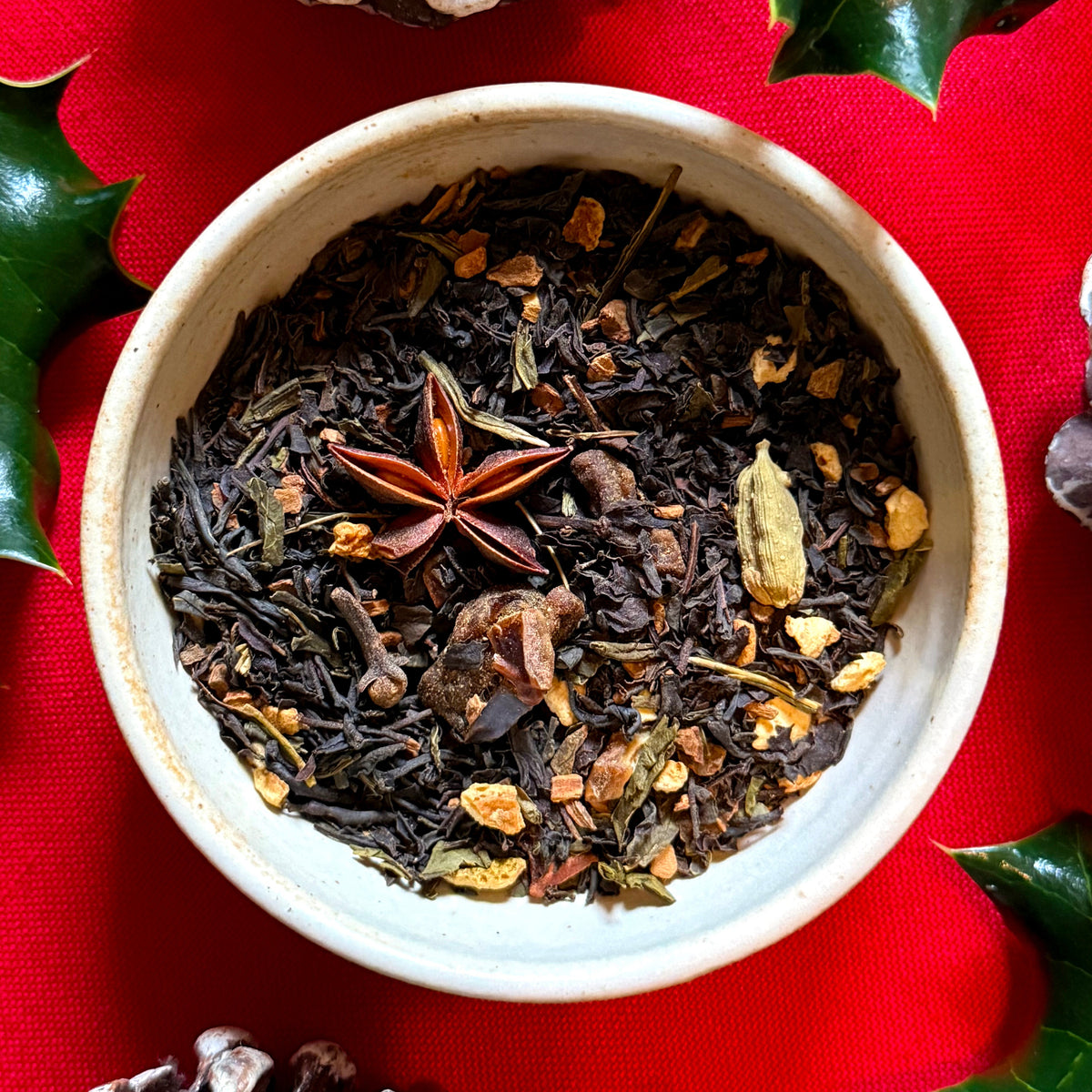 Gingerbread tea with spices on festive background
