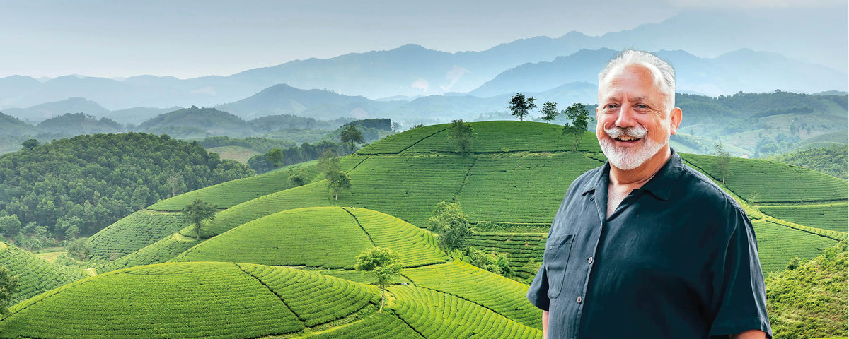 Alexis in front of Chinese tea growing region